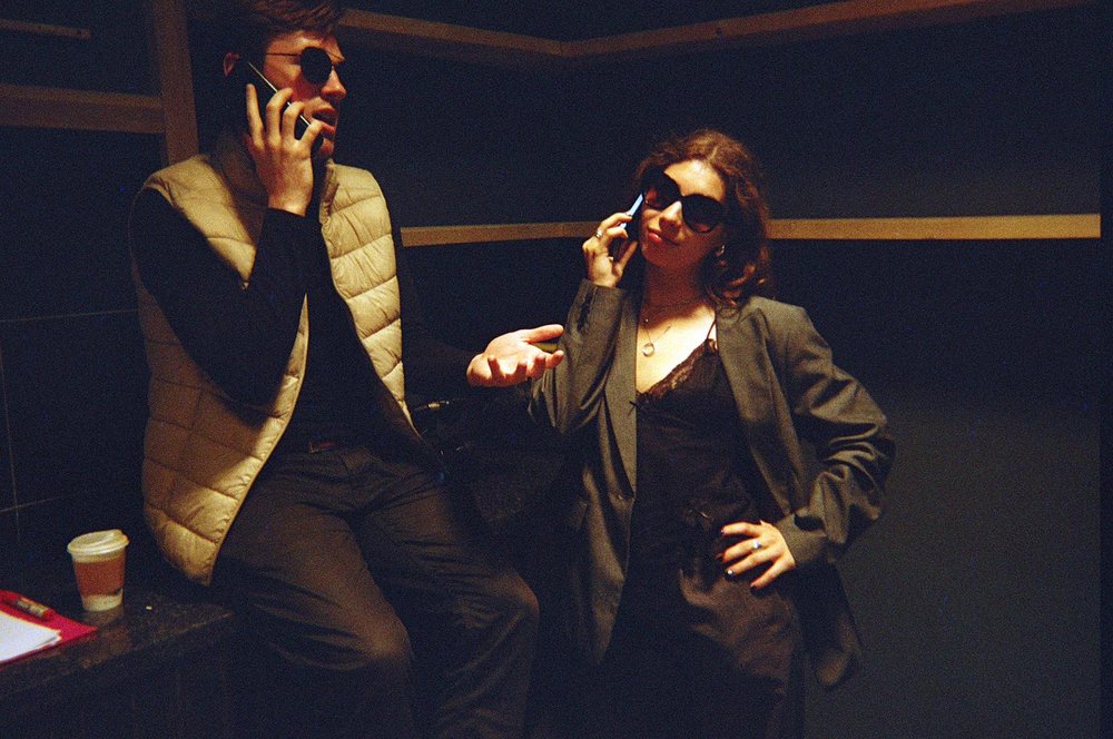 On set, actors in character between takes